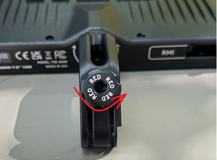 A black device with a red circle on it

Description automatically generated